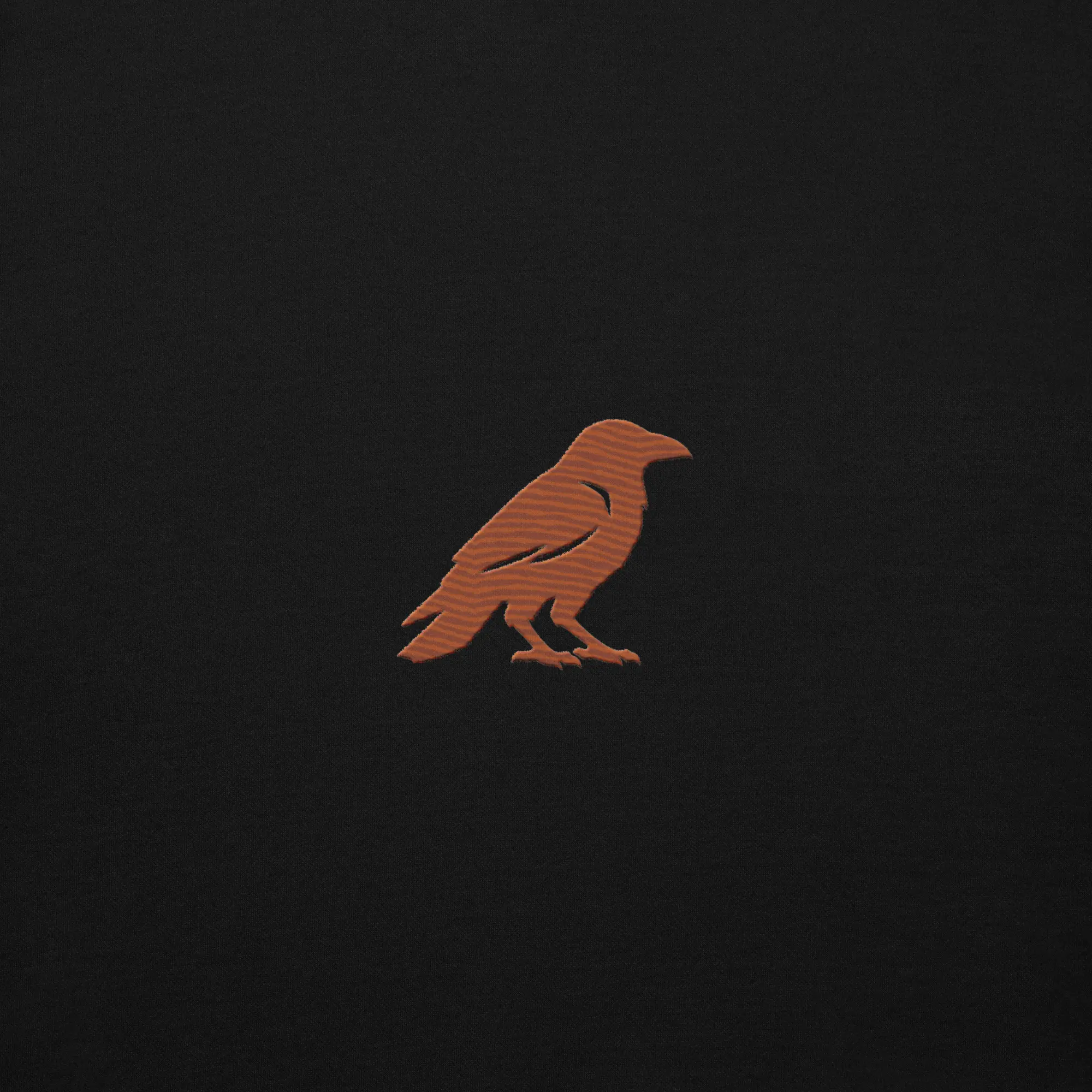 blkfog-standard-issue-crewneck-crow-embroidery Close up of rust crow embroidery on BLKFOG Standard Issue crewneck