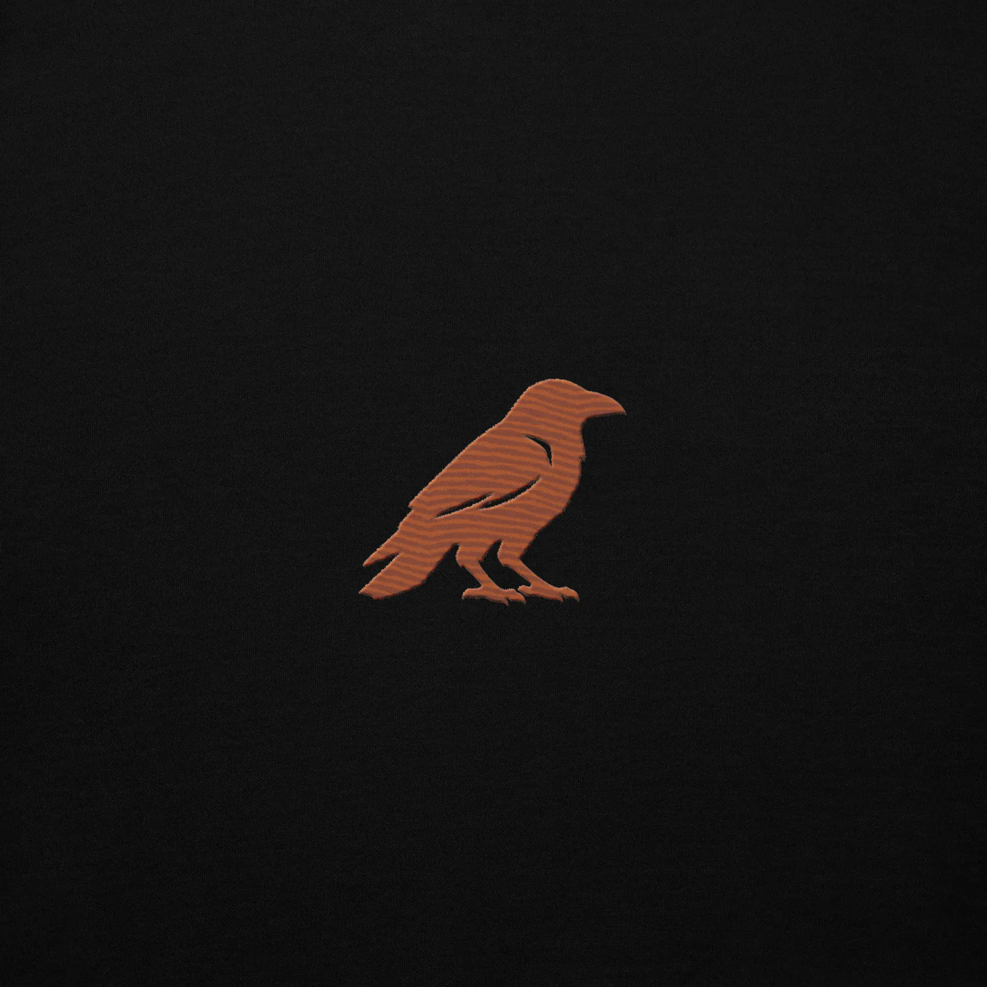 blkfog-standard-issue-hoodie-crow-embroidery Close up of rust crow embroidery on BLKFOG Standard Issue hoodie