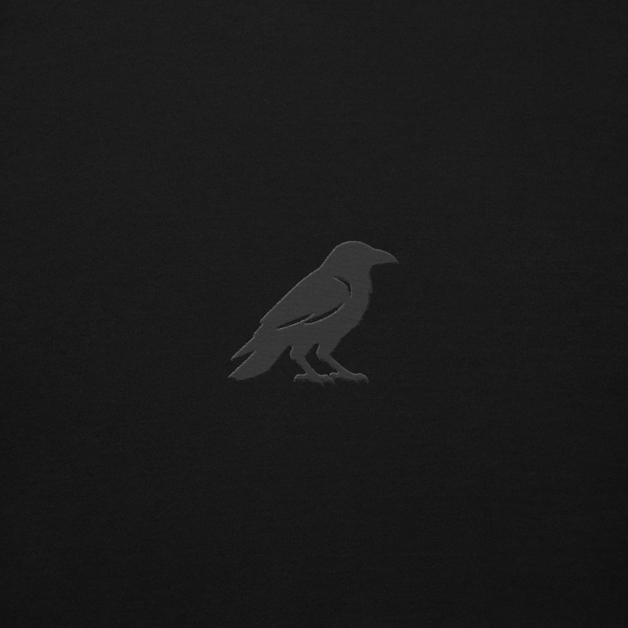 blkfog-standard-issue-stealth-crewneck-crow-embroidery Close up of black crow embroidery on BLKFOG Standard Issue Stealth crewneck